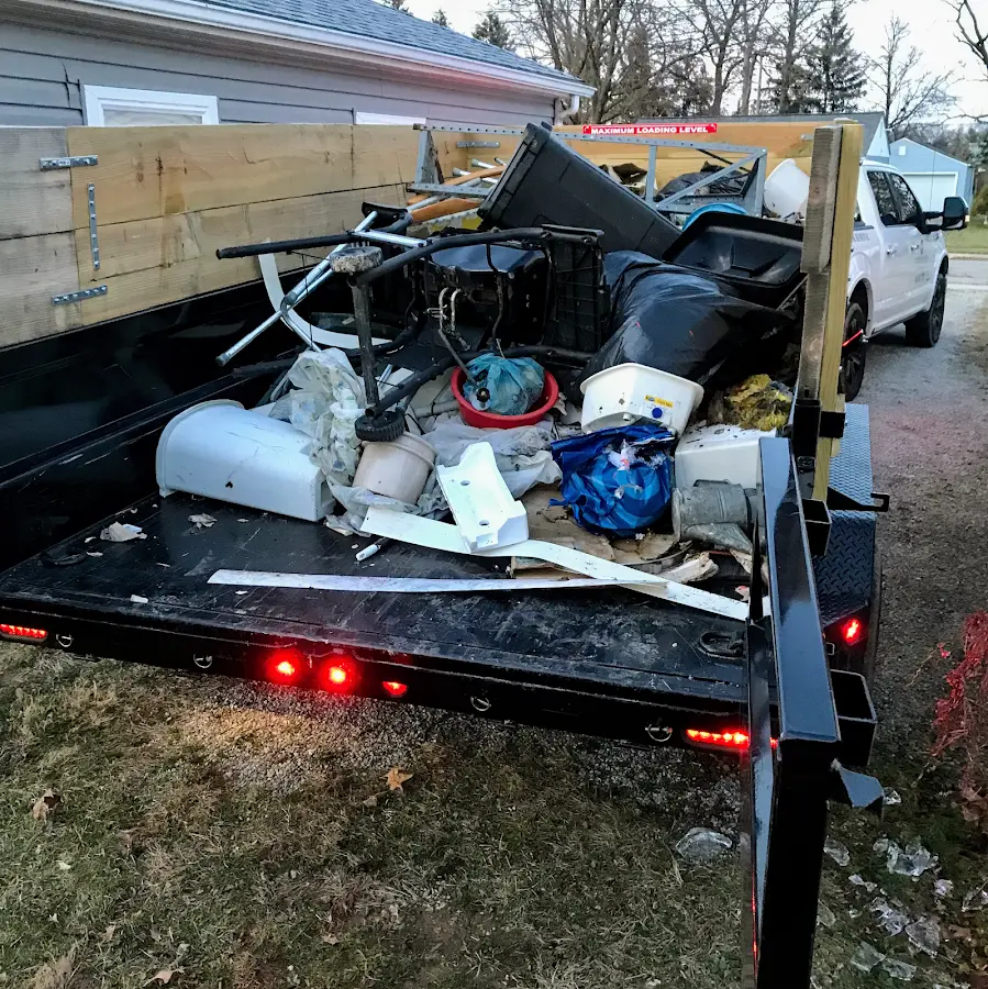 Roll-off dumpster delivered to a residential driveway in Farmers Loop